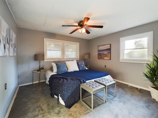 bedroom with dark carpet and ceiling fan