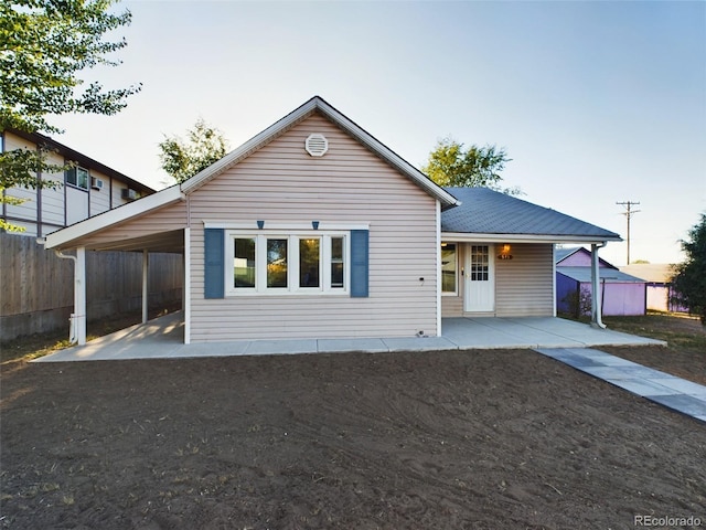 view of front of home with a carport