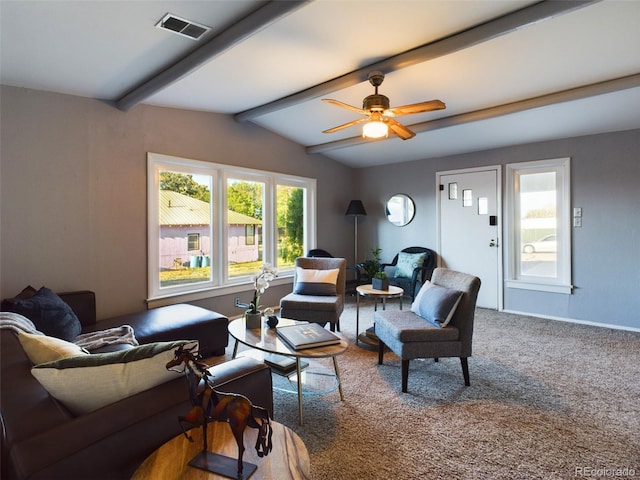 living room with vaulted ceiling with beams, ceiling fan, and carpet flooring