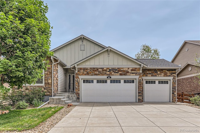 view of front facade with board and batten siding, driveway, and an attached garage