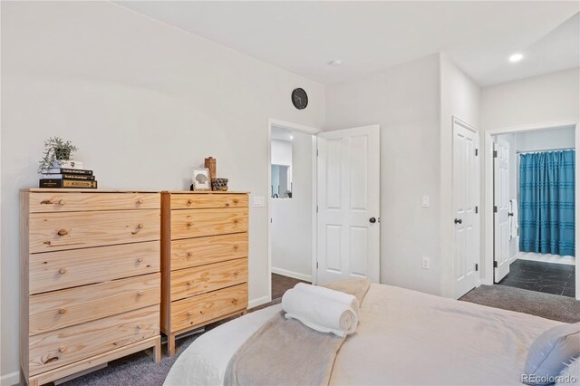 4085 S Crystal Cir Unit 101, Aurora, CO 80014 - bedroom featuring ensuite bathroom, recessed lighting, and dark carpet