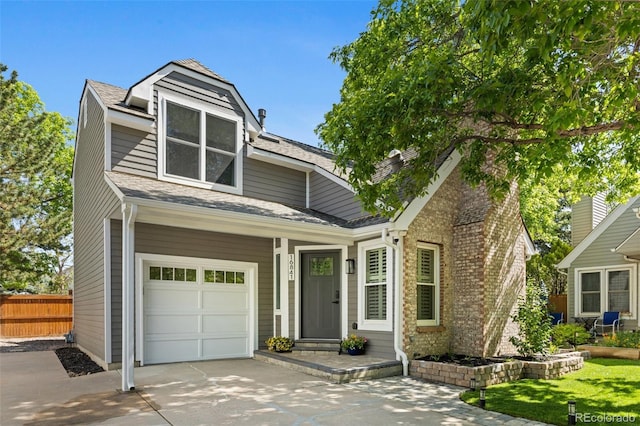 16841 E Hialeah Ave, Centennial, CO 80015 - view of front of house featuring driveway, an attached garage, and roof with shingles