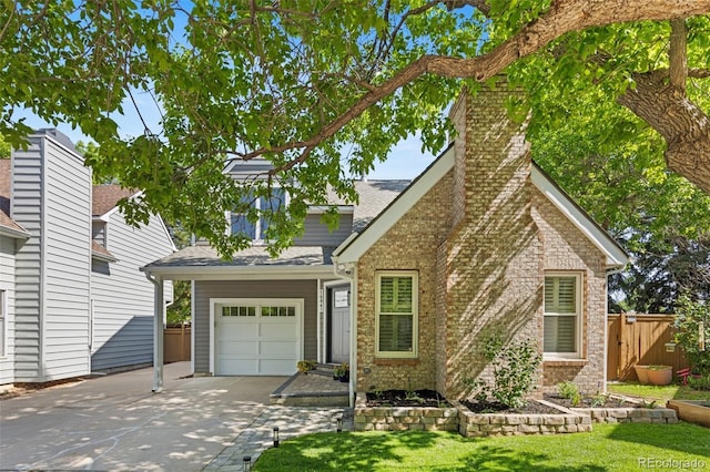 16841 E Hialeah Ave, Centennial, CO 80015 - view of front of house featuring driveway, brick siding, roof with shingles, a garage, and a chimney