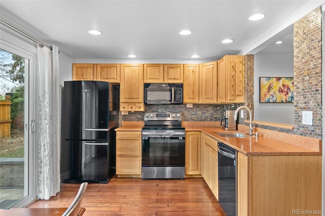 16841 E Hialeah Ave, Centennial, CO 80015 - kitchen featuring black appliances, light brown cabinets, wood finished floors, and recessed lighting