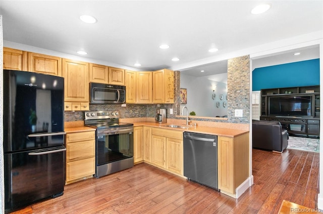 16841 E Hialeah Ave, Centennial, CO 80015 - kitchen featuring black appliances, light brown cabinets, decorative backsplash, light wood-style flooring, and recessed lighting