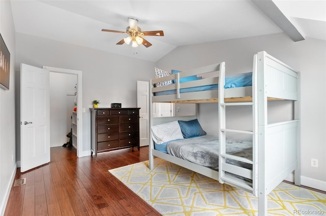 16841 E Hialeah Ave, Centennial, CO 80015 - bedroom with lofted ceiling, wood-type flooring, a walk in closet, and a ceiling fan