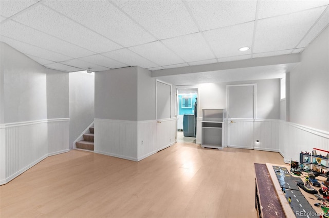 16841 E Hialeah Ave, Centennial, CO 80015 - finished below grade area featuring a wainscoted wall, wood finished floors, stairs, and a drop ceiling