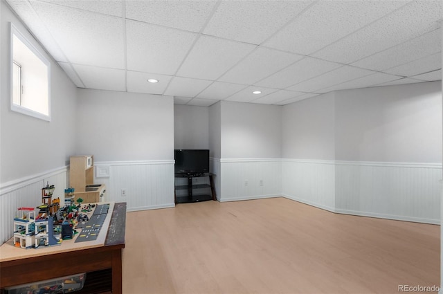16841 E Hialeah Ave, Centennial, CO 80015 - recreation room featuring wood finished floors, a wainscoted wall, a drop ceiling, and recessed lighting