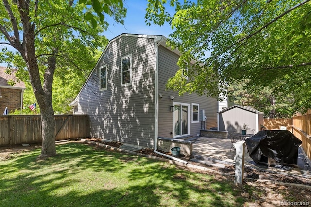 16841 E Hialeah Ave, Centennial, CO 80015 - rear view of house with a fenced backyard and a storage unit