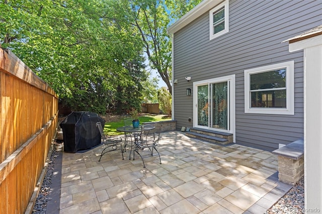 16841 E Hialeah Ave, Centennial, CO 80015 - fenced backyard with area for grilling, a patio, and outdoor dining space