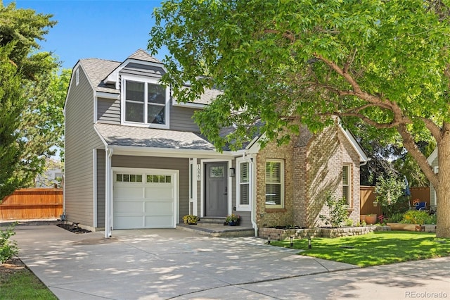 16841 E Hialeah Ave, Centennial, CO 80015 - view of front of property with a garage, concrete driveway, and roof with shingles