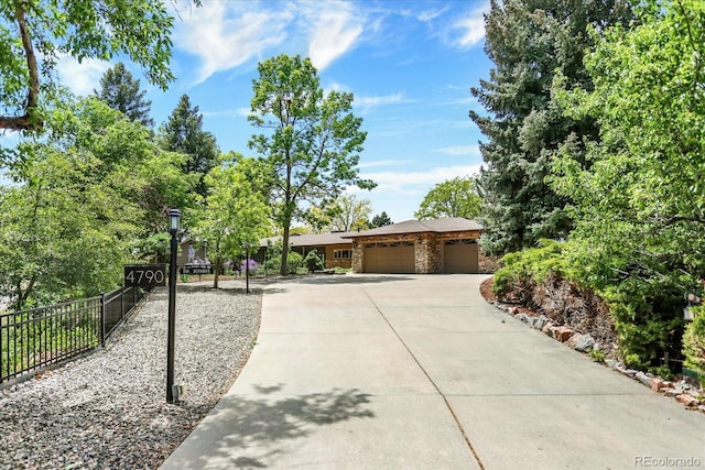 4790 W Lakeridge Rd, Denver, CO 80219 - view of front facade with an attached garage and concrete driveway