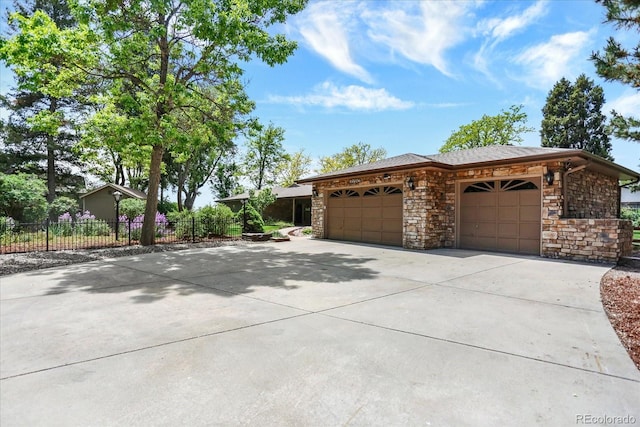 4790 W Lakeridge Rd, Denver, CO 80219 - single story home featuring a garage, driveway, and stone siding