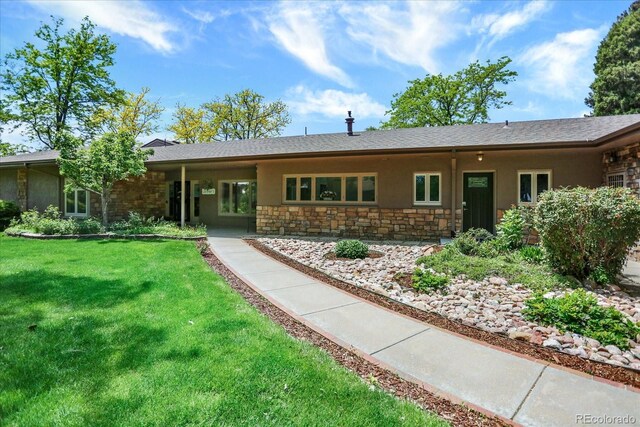 4790 W Lakeridge Rd, Denver, CO 80219 - single story home featuring stone siding, stucco siding, and a front yard