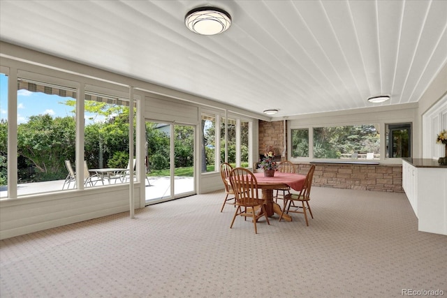 4790 W Lakeridge Rd, Denver, CO 80219 - sunroom featuring carpet floors, plenty of natural light, and outdoor dining space