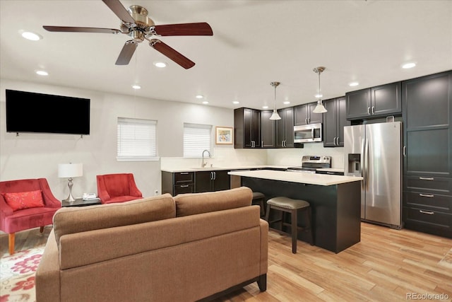4790 W Lakeridge Rd, Denver, CO 80219 - living area with a ceiling fan, light wood-style floors, and recessed lighting
