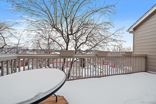 view of snow covered deck