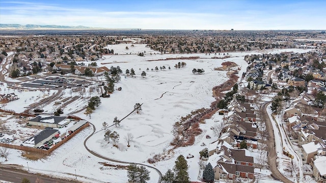 snowy aerial view with a mountain view