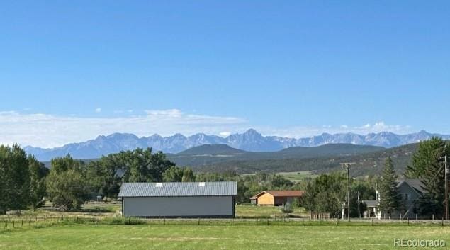 property view of mountains featuring a rural view