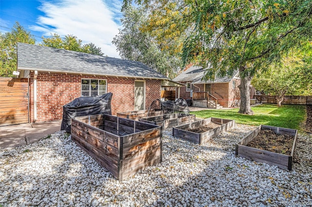 rear view of property featuring a lawn