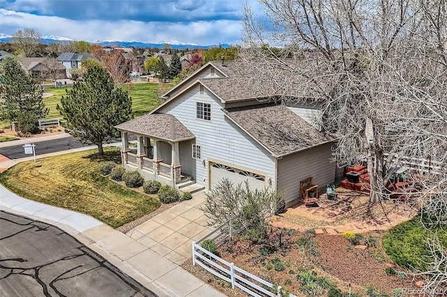 11638 Xavier Way, Westminster, CO 80031 - traditional-style home featuring covered porch, roof with shingles, concrete driveway, and an attached garage