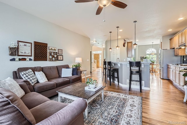 11638 Xavier Way, Westminster, CO 80031 - living area with light wood-type flooring, a ceiling fan, and recessed lighting