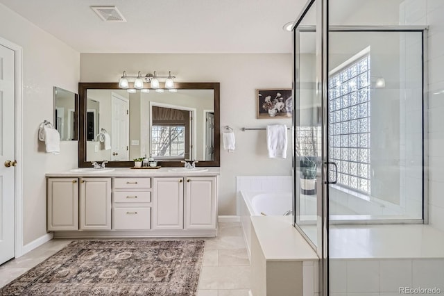 11638 Xavier Way, Westminster, CO 80031 - bathroom with a bath, double vanity, and a shower stall