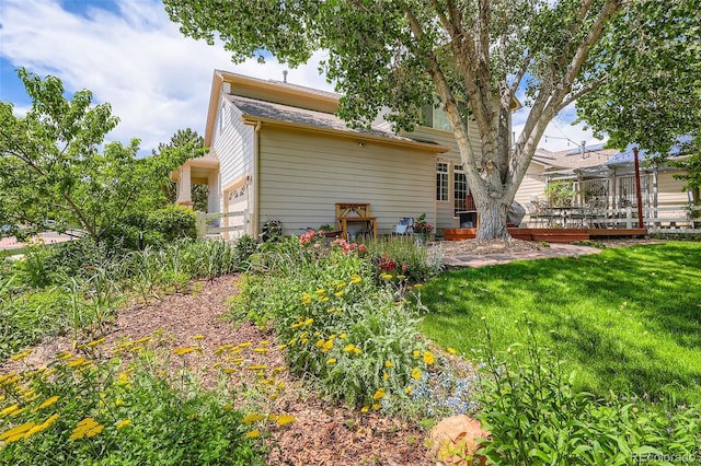 11638 Xavier Way, Westminster, CO 80031 - back of house with a wooden deck and a lawn