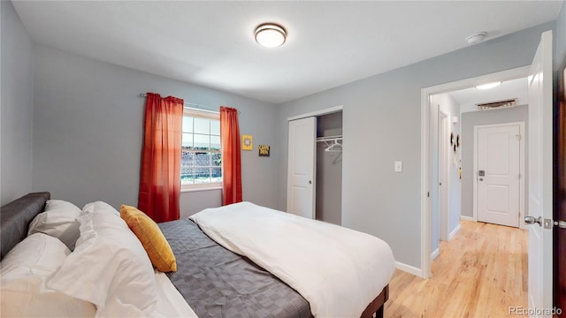 7609 Sherman Pl, Denver, CO 80221 - bedroom with light hardwood / wood-style floors and a closet