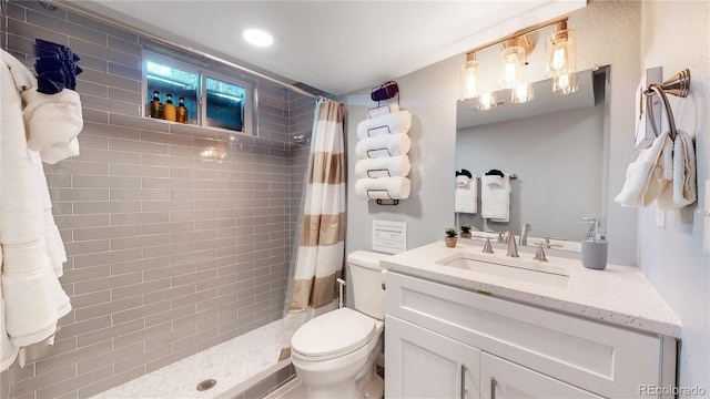 7609 Sherman Pl, Denver, CO 80221 - bathroom with vanity, toilet, and a shower with shower curtain