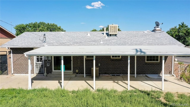 7609 Sherman Pl, Denver, CO 80221 - back of house with a patio and central air condition unit