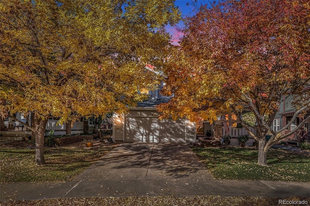 obstructed view of property featuring a garage