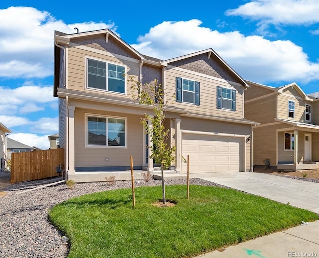 view of front of property with a garage and a front yard