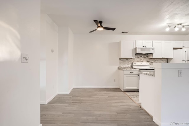 kitchen featuring white cabinetry, white appliances, light hardwood / wood-style floors, and tasteful backsplash