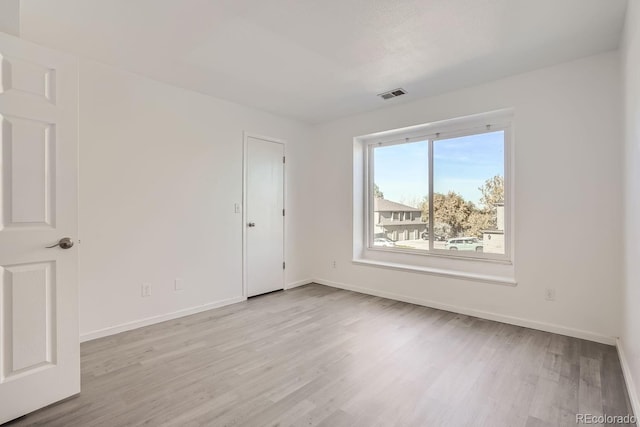 unfurnished room featuring light wood-type flooring