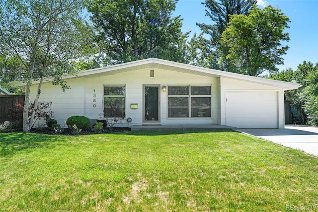 1360 S Hudson St, Denver, CO 80222 - view of front of house with concrete driveway, an attached garage, and a front yard