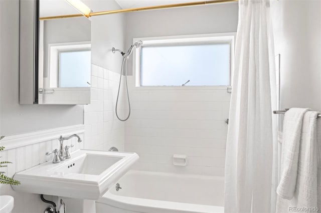 1360 S Hudson St, Denver, CO 80222 - full bath featuring shower / tub combo with curtain and wainscoting