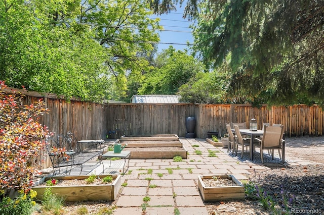 1360 S Hudson St, Denver, CO 80222 - fenced backyard with a garden and a patio area