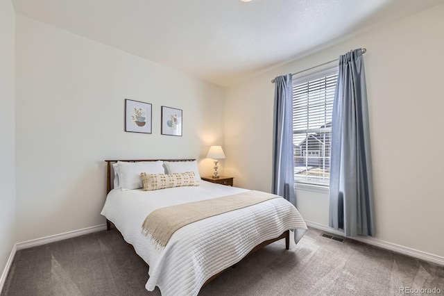 bedroom with carpet, baseboards, and visible vents