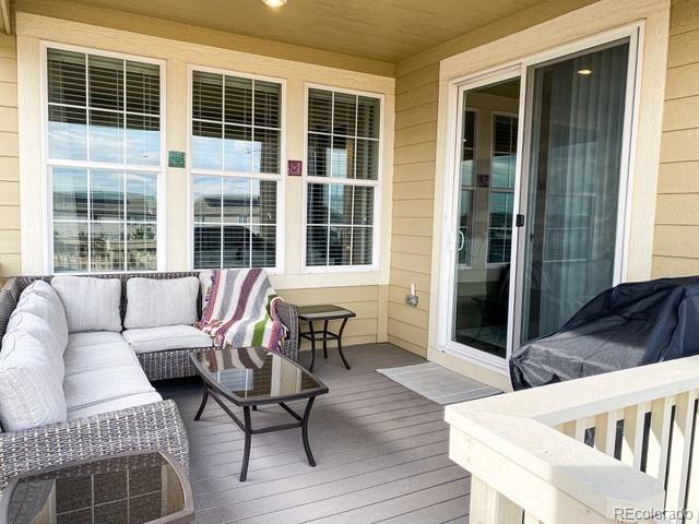wooden deck featuring an outdoor living space