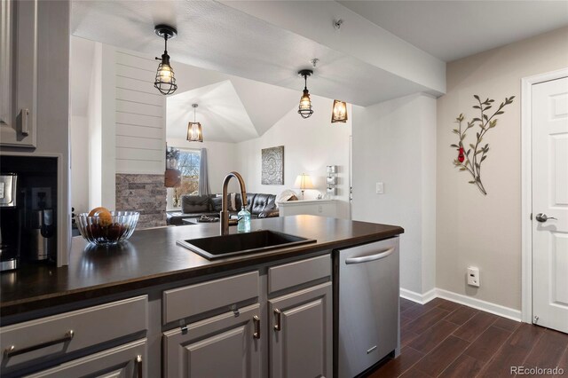 kitchen featuring sink, dishwasher, and pendant lighting