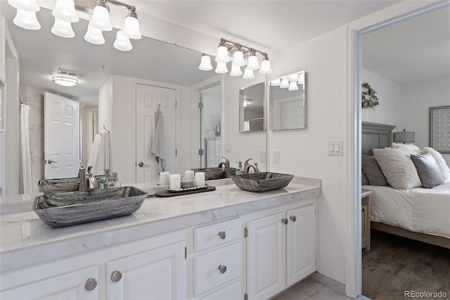 bathroom with wood-type flooring and vanity