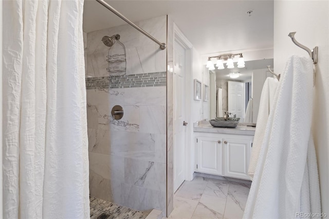 bathroom with walk in shower and vanity