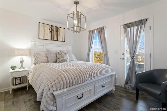 bedroom featuring an inviting chandelier, access to outside, and dark wood-type flooring