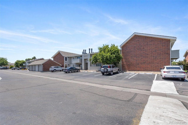 10150 E Virginia Ave Unit 11-202, Denver, CO 80247 - uncovered parking lot with a residential view