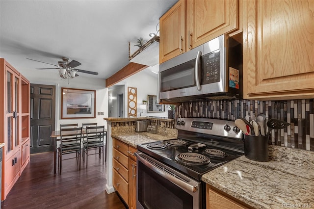 10150 E Virginia Ave Unit 11-202, Denver, CO 80247 - kitchen with appliances with stainless steel finishes, a ceiling fan, light stone counters, and dark wood-type flooring