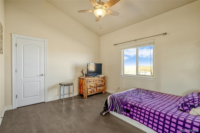 bedroom with vaulted ceiling, ceiling fan, baseboards, and wood finished floors