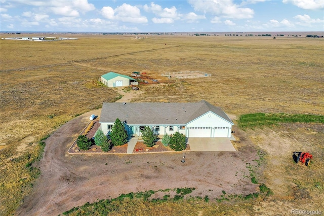 birds eye view of property with a rural view