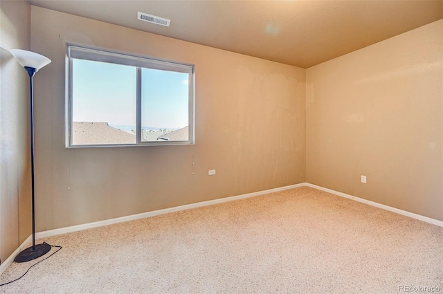 unfurnished room with carpet floors