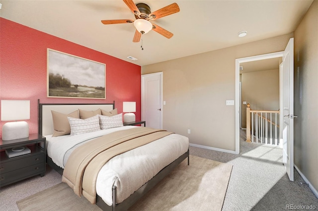 bedroom featuring light colored carpet and ceiling fan